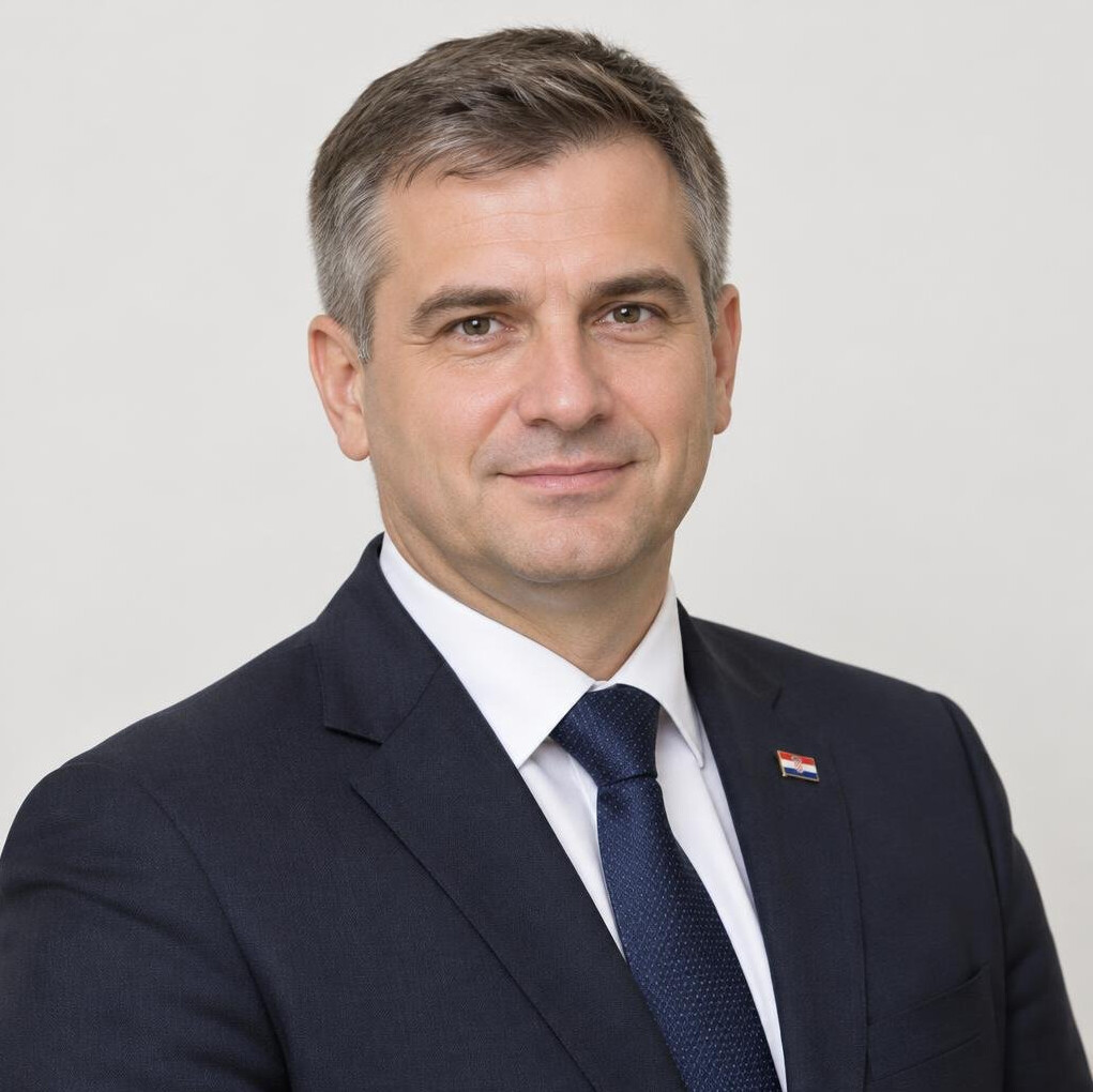 Portrait of a man in a dark suit and tie